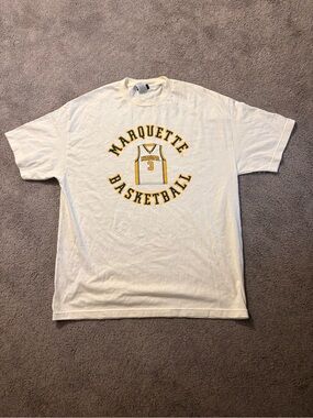 Champs White Marquette Basketball Short Sleeve Tee with Yellow Logo